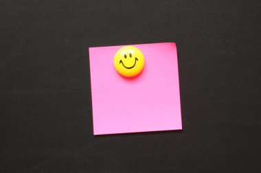 Smiley and paper with copyspace clipart