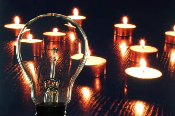 Bulb and candle — Stock Photo, Image