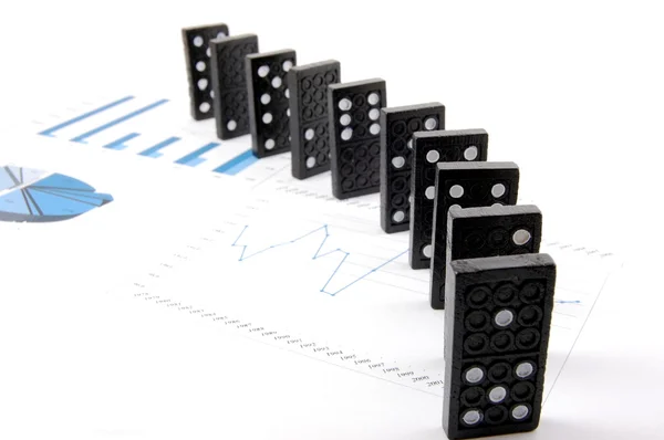 Dominoes on chart — Stock Photo, Image