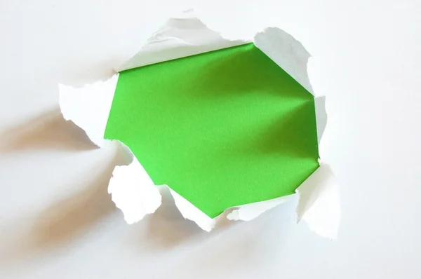 Green hole in blank sheet paper — Stock Photo, Image