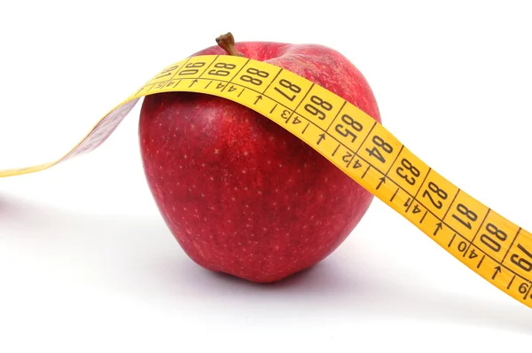 Elma ve beyaz kasette ölçme — Stok fotoğraf