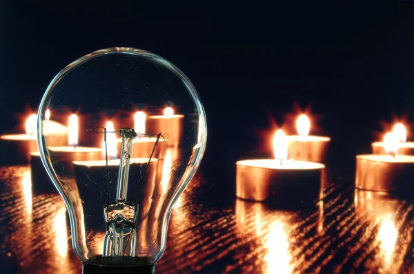Bulb and candle — Stock Photo, Image