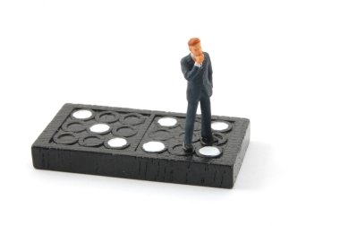 Business man on domino isolated clipart