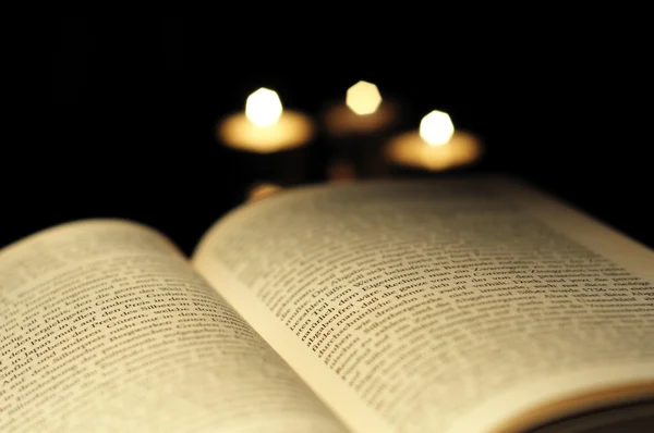 Book and candle — Stock Photo, Image