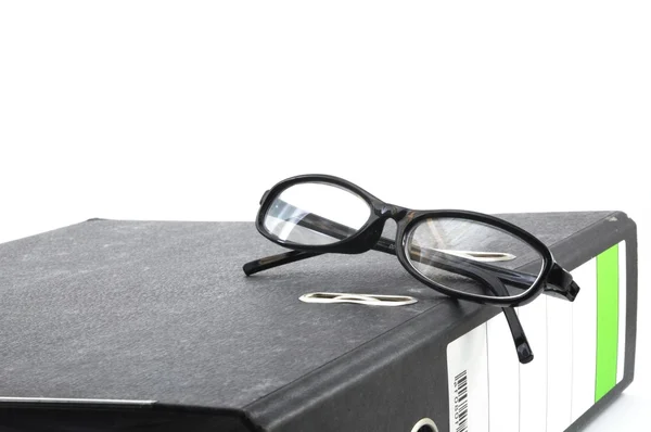 Óculos de olho e pasta — Fotografia de Stock
