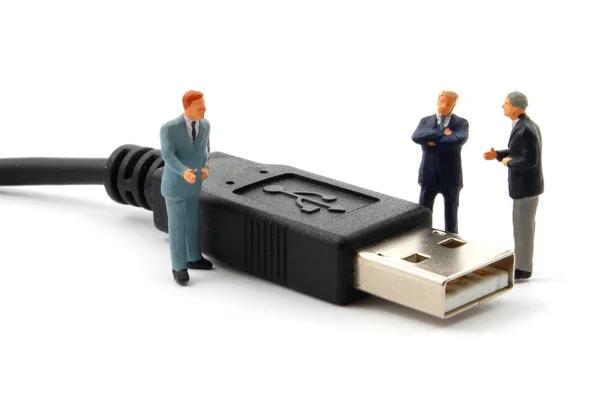 Hombre de negocios y conector USB — Foto de Stock