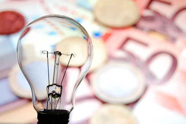 Bulb with business background — Stock Photo, Image