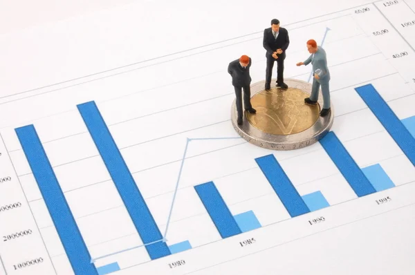 Businessman and money over a chart — Stock Photo, Image