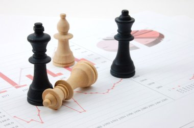 Chess man over business chart clipart