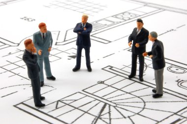 Meeting of businessman on architecture plan clipart