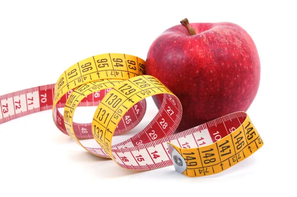 Pomme et ruban à mesurer sur blanc — Photo