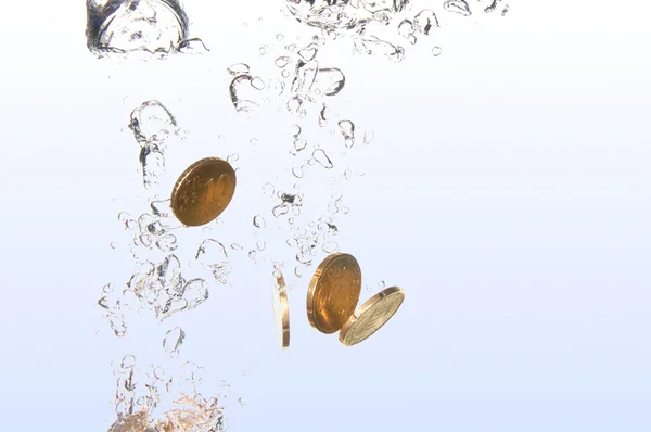 stock image Coins in water