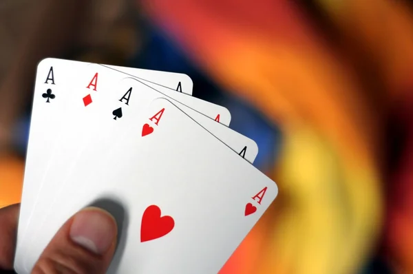 stock image Hand holding four aces