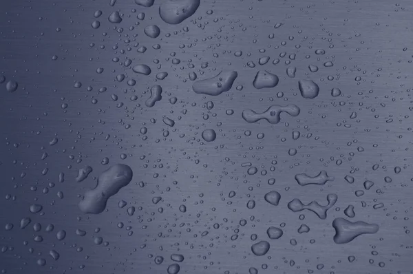 Gotas de água na superfície do metal — Fotografia de Stock