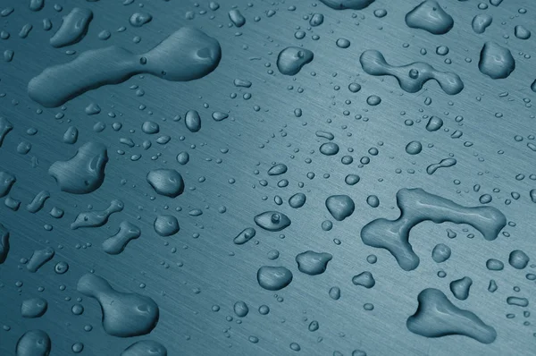 Krople wody na metalowej powierzchni — Zdjęcie stockowe