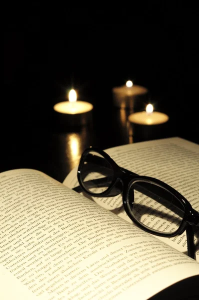 Book candle and glasses — Stock Photo, Image