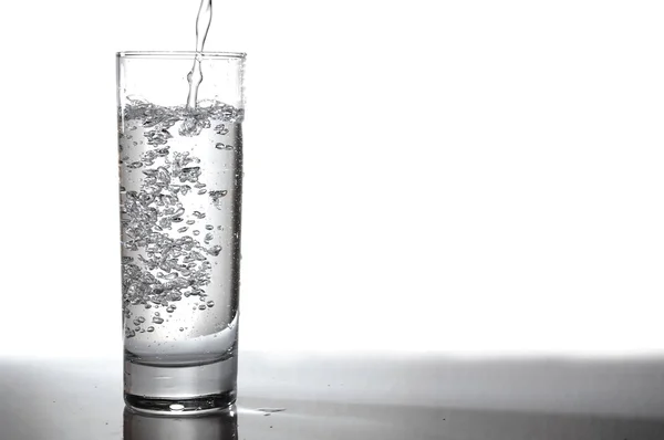 stock image Glass of water pouring