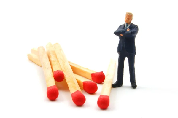 Business man and matches on white — Stock Photo, Image