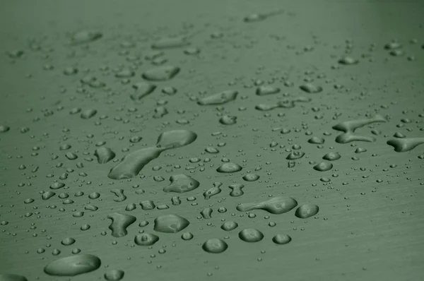Vattendroppar på metallytan — Stockfoto