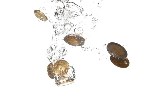 Coins in water — Stock Photo, Image