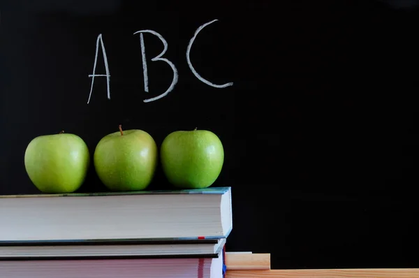 Blackboard and apples Royalty Free Stock Images