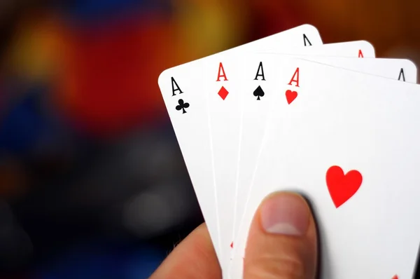 Hand holding four aces — Stock Photo, Image