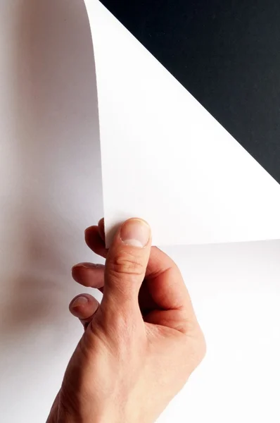 Hand draaien papier — Stockfoto