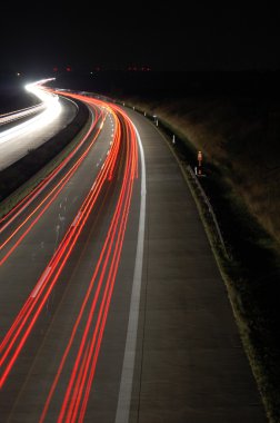 Highway at night with traffic clipart