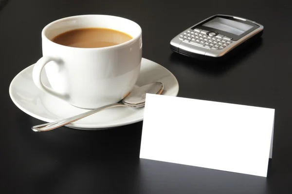 Cup of coffee and paper copyspace — Stock Photo, Image