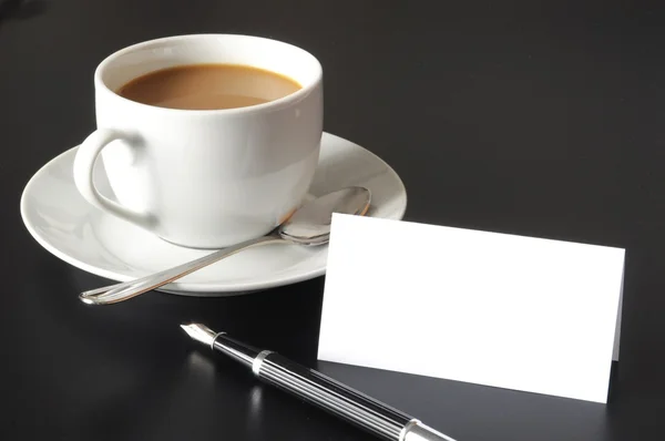 Kopje koffie en papier copyspace — Stockfoto