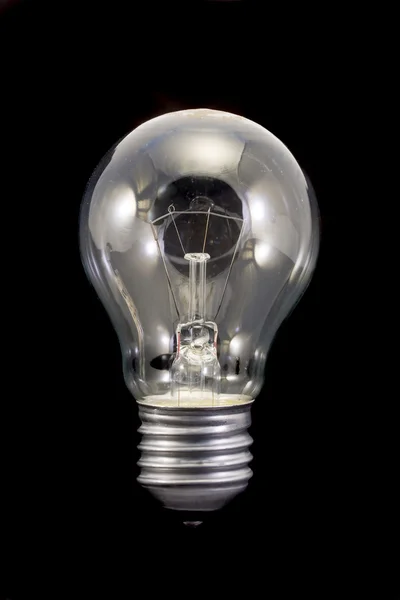 stock image Light bulb on black