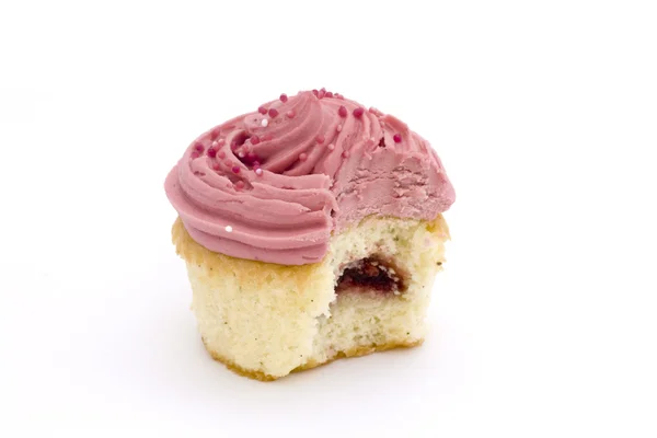 Ροζ cupcake με δάγκωμα λαμβάνονται — Φωτογραφία Αρχείου