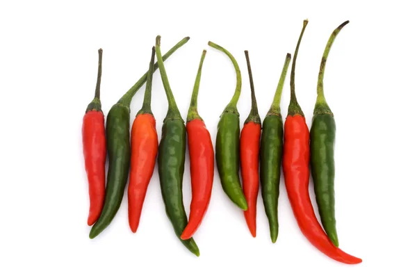 Line of green and red chillies — Stock Photo, Image