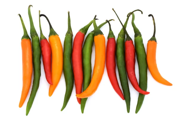 Mixed coloured chilli peppers — Stock Photo, Image