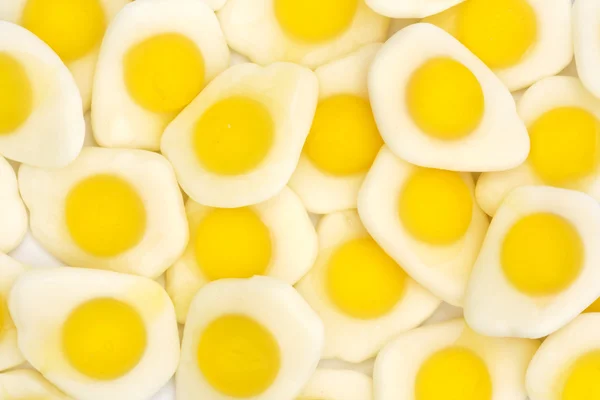 Pozadí sázeným vejcem žvýkací bonbóny — Stock fotografie