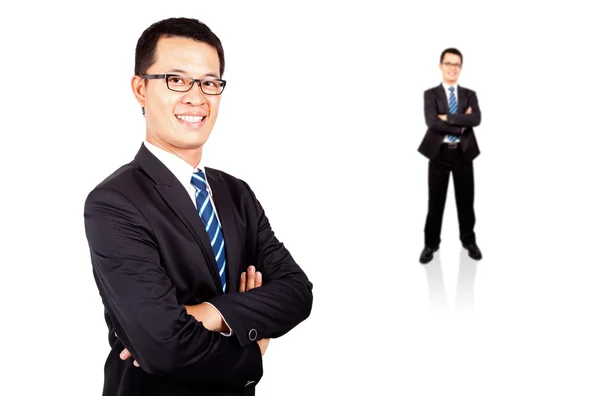 Smiling young businessman standing — Stock Photo, Image