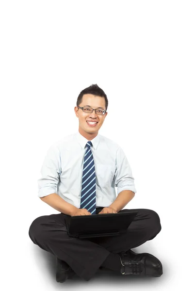 Affärsman sitter och använder bärbar dator — Stockfoto