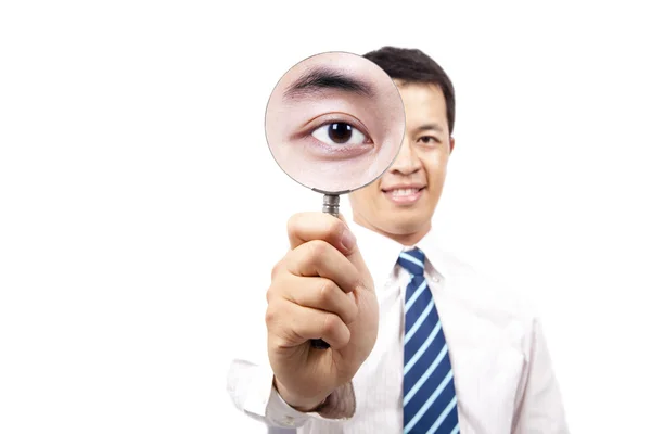 Businessman holding Magnifier — Stock Photo, Image