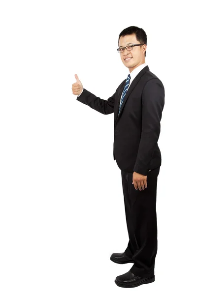 立っているビジネスマンおよび親指のアップ — ストック写真