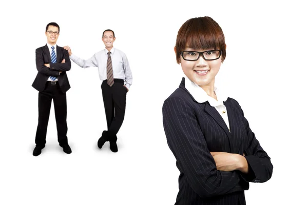 Smiling businesswoman and business team — Stock Photo, Image