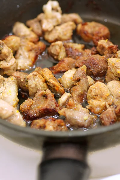 stock image Meat is fried in a pan