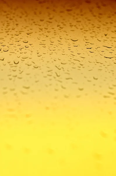 黄色のグラデーション水滴の背景 ロイヤリティフリーのストック画像