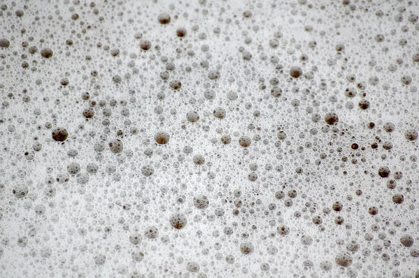 Textura bublin oceán na vlhký písek — Stock fotografie