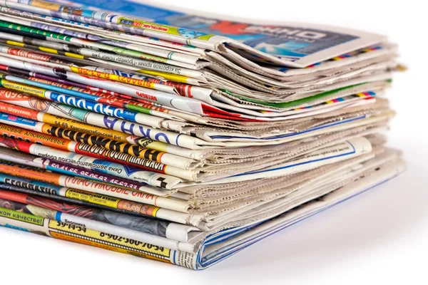 A pile of newspapers isolated — Stock Photo, Image