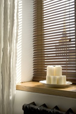Image of candles on a windowsill clipart