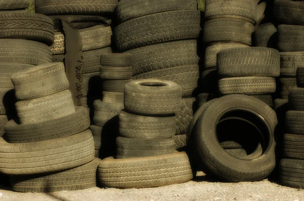 stock image Pile of old tires and wheels