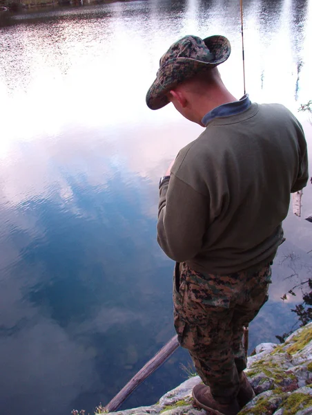 stock image Man fishing in a pond.