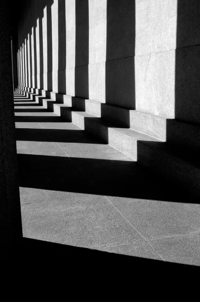Shadows on modern columns on the floor