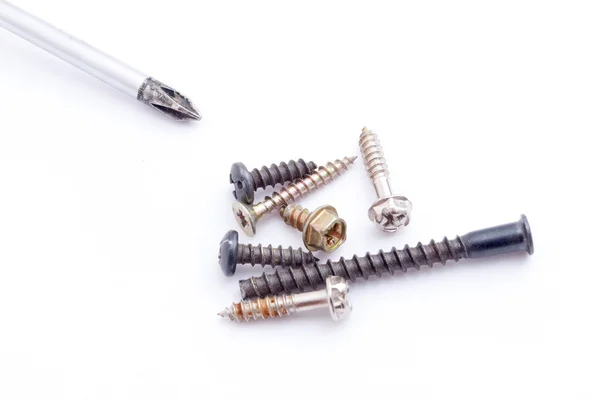 Screwdriver and screws — Stock Photo, Image