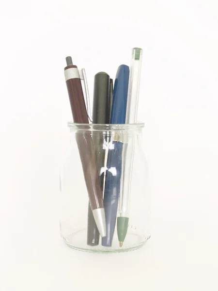 Cam şişe ve kalemler — Stok fotoğraf